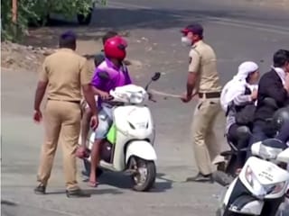 Indian police beat motorists to enforce coronavirus lockdown