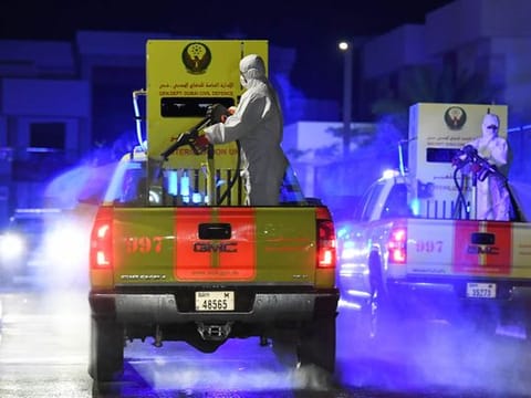 Municipal workers disinfect the streets of Dubai  as a preventive measure against the spread of coronavirus.  