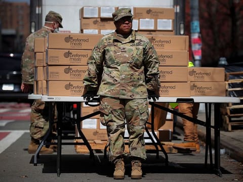 U.S. Army National Guard personnel distribute free preferred meals to residents in the East Harlem section of Manhattan during the outbreak of the coronavirus disease (COVID-19) in New York City, New York, U.S., April 1, 2020. 