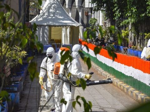 Health workers sanitise an area near Nizamuddin mosque, after people who attended the religious congregation at Tabligh Jamaat's Markaz, tested postive for COVID-19, in New Delhi April 1.