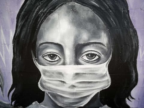 A painting by the graffiti artist Bandit titled Our Nurses, Our Saints is seen on a wall in the lower ninth ward in New Orleans, Louisiana, on April 03, 2020. 