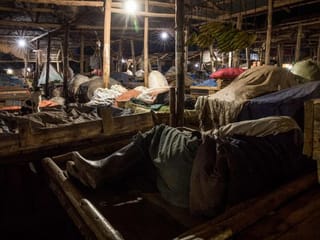 Photos: Ugandan vendors sleep in markets to curb the spread of coronavirus