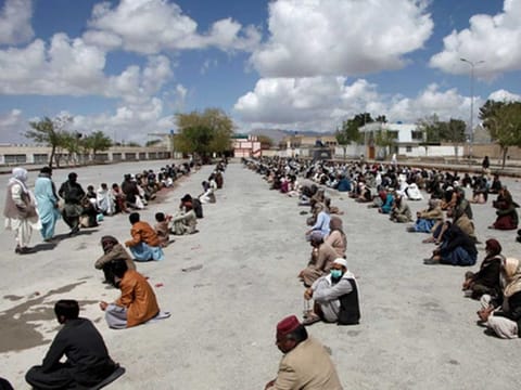 People are waiting to Quetta to receive ration as businesses close due to partial lockdown in Balochistan. 