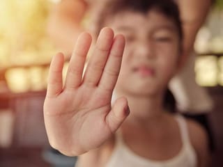 Why you should never force kids to kiss family members