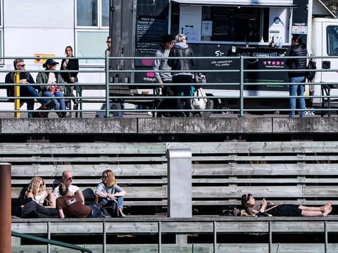 People relax in the sun, as the spread of the coronavirus disease (COVID-19) continues,  in Malmo, Sweden earlier this month