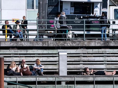 People relax in the sun, as the spread of the coronavirus disease (COVID-19) continues,  in Malmo, Sweden earlier this month