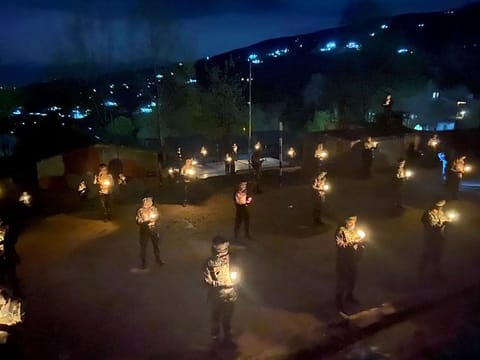 Indian army personnel light candles, on an exercise called by Prime Minister Narendra Modi to switch off all lights of houses on April 5, at 9 PM for 9 minutes and just light candles, or mobile's flashlight, to mark the fight against Coronavirus, in Poonch