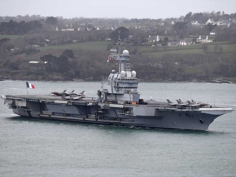 The French aircraft carrier Charles de Gaulle arrives in the port of Brest, in western France on March 13, 2020. The French Army ministry announced on April 8, 2020 that nearly 40 sailors onboard the French aircraft carrier Charles de Gaulle show alleged symptoms of COVID-19. The aircraft carrier Charles de Gaulle currently in the Atlantic ocean was set to arrive in Toulon, southern France, on April 23.