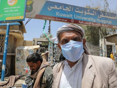 A man wears a protective face mask as he leaves a hospital which is allocated for coronavirus patients in preparation for any possible spread of the coronavirus disease (COVID-19), in Sanaa
