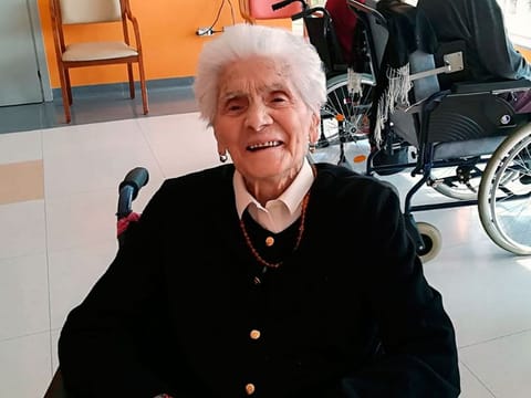In this photo taken on April 6, 2020, 103-year-old Ada Zanusso, poses for pictures at the nursing home "Maria Grazia" in Lessona, northern Italy, after recovering from Covid-19 infection.