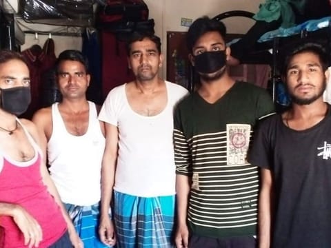 A group of Indian men at their Sharjah accommodation from where they were evicted over unpaid rents on Saturday  Supplied 
