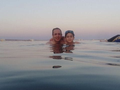 This undated photo from 2016 shows Dr. Ahmed Al Lawah  and his son during a vacation in Egypt. Al Lawah died on March 30 after he was infected by the new coronavirus. He was the first doctor to die from the COVID-19 in Egypt. 