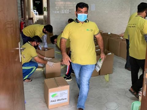PAD volunteers preparing food packages to deliver to needy people at the doorsteps in the UAE