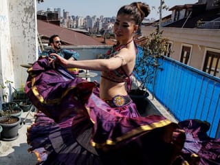 Dancer, musicians in Istanbul perform from a terrace to the delight of isolated neighbors