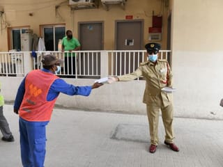 COVID-19: Dubai Police give away food baskets to workers
