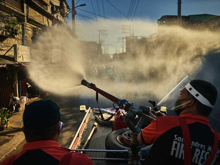 Manila Firefighters spray disinfectant lockdown Luzon