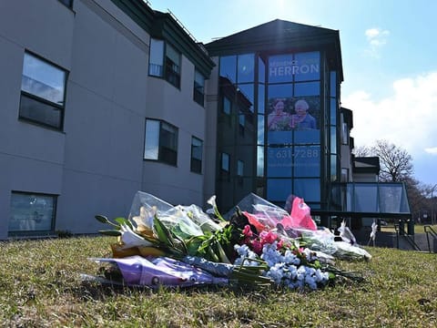 Flowers outside the Herron private nursing home in Dorval, west of Montreal, on April 16, 2020.  The discovery of 31 deaths at Montreal's Herron nursing home has prompted an investigation into alleged gross negligence after caregivers fled amid a coronavirus outbreak.