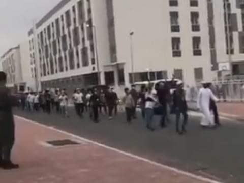 About 150 patients who recovered from COVID-19 cheer medical workers and volunteers follows weeks of stay in a quarantine facility in Dubai's Warzan district. 
