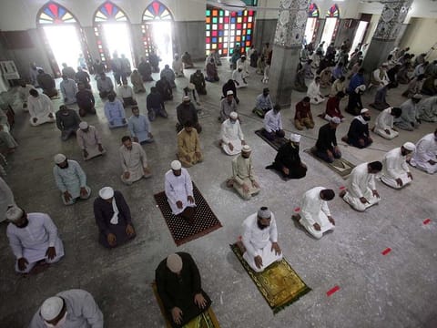 Worshipers maintain safe distance as they attend Friday prayer in Lahore, Pakistan