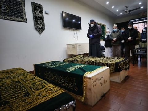 Caskets of Muslims who have passed away from the coronavirus are prepared for burial at a busy Brooklyn funeral home on the first day of Ramadan on April 24 in New York City. Like the majority of New York City funeral homes, services that deal with the dead in New York's Muslim communities have been overwhelmed with the large number of deceased. 
