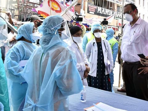 Central COVID-19 team members interacting with the GHMC health team during their inspection at containment zone area, Fakheer Galli Old Malakpet, in Hyderabad on Sunday.
