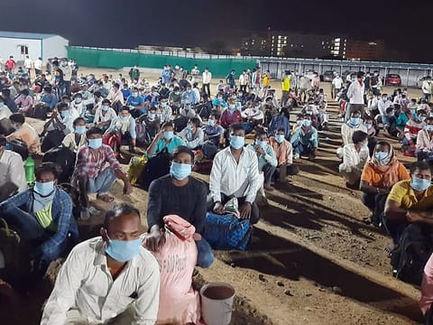 Passengers wait to board the train at Lingampalli railway station, in Hyderabad on Friday. A one-off special train was run from Lingampalli (Hyderabad) to Hatia (Jharkhand) on the request of the Telangana government and as per the directions of Union Railway Ministry. 