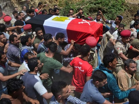 Mourners carry the coffin of Alaa Emad, an Egyptian soldier who was killed in an explosion targeting an armoured vehicle near Bir Al Abed in North Sinai, during his funeral in the vilage of Abwan in the Minya province on May 1.
