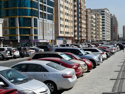 Cars parked in the parking at a residential area. Photo : 