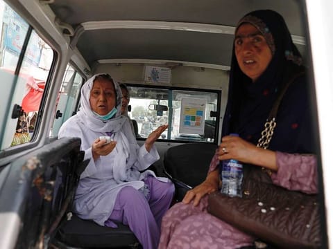Afghan women sit in an ambulance after being rescued by security forces during an attack and gunfire at a hospital in Kabul, Afghanistan May 12, 2020. 