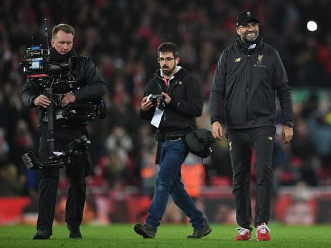 In this file photo taken on December 29, 2018 A television camera operator films Liverpool's German manager Jurgen Klopp following  the English Premier League football match between Liverpool and Arsenal at Anfield.