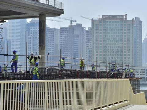 Construction workers hard at work during the afternoon Photo Clint Egbert/Gulf News