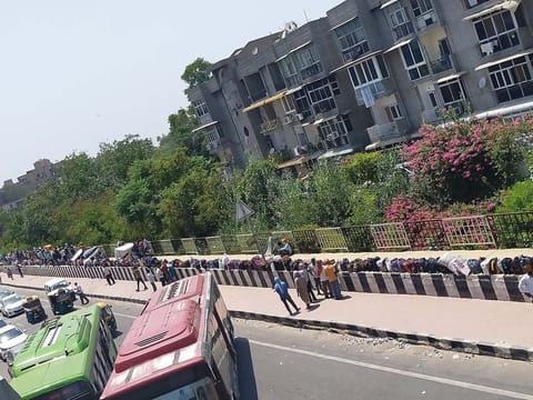 Migrant workers' bags line India's roads as they wait to go home