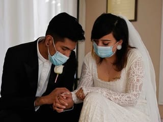Using face masks and sanitizer, couples say 'I do' in Vegas