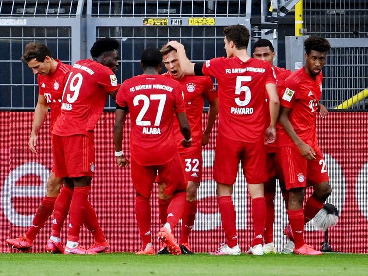 Bayern Munich's Joshua Kimmich celebrates scoring the only goal of the game against Borussia Dortmund