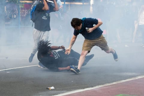 Protesters are tear gassed as the police disperse them near the White House on June 1, 2020 as demonstrations against George Floyd's death continue.  