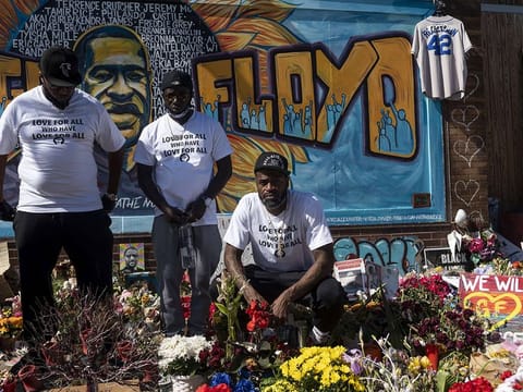 Former NBA player Stephen Jackson (R), a friend of George Floyd's, poses for a photograph at a memorial for Floyd in Minneapolis, Minnesota. 