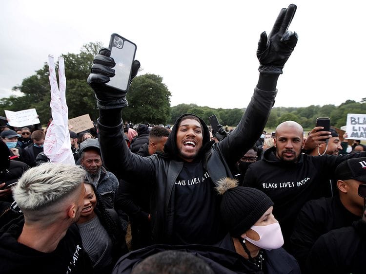 Boxer Anthony Joshua is seen with demonstrators during a Black Lives Matter protest in Watford, following the death of George Floyd who died in police custody in Minneapolis, Watford, Britain, June 6, 2020. 