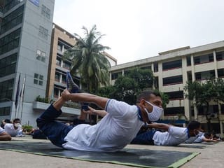 Bangladesh police turn to yoga to boost health during COVID-19 pandemic