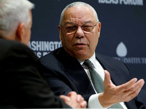 Former US Secretary of State Colin Powell (R) takes part in an onstage interview with Aspen Institute President and CEO Walter Isaacson (L) at the Washington Ideas Forum in Washington, September 30, 2015.