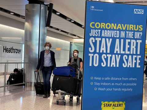 File photo: A signboard at Heathrow Airport following the outbreak of the coronavirus disease (COVID-19). 