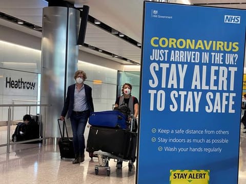 Passengers arrive at Heathrow Airport, as Britain launches its 14-day quarantine for international arrivals, following the outbreak of the coronavirus disease (COVID-19), London, Britain, June 8, 2020. 