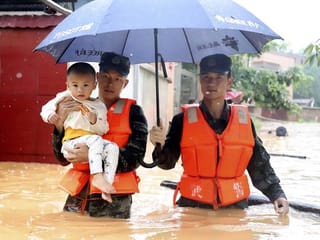 Dozens killed as south China hit by floods and rainstorms