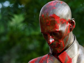 Photos: Statue of famous Italian journalist defaced in Milan