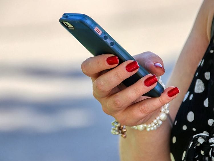Woman using mobile phone, whatsapp