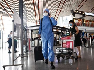 Beijing cancels flights, shuts schools as COVID-19 cases spike 