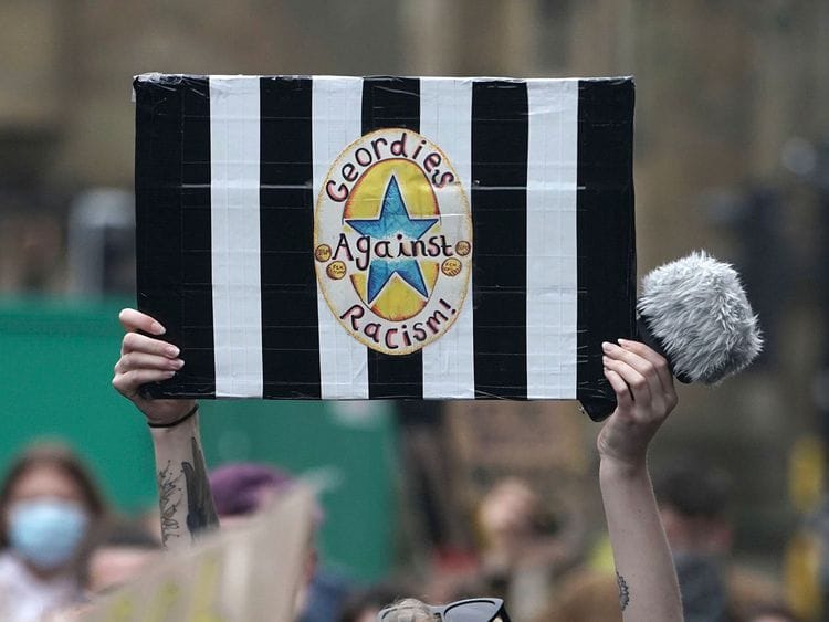 A Newcastle United fan at a Black Lives Matter demonstration