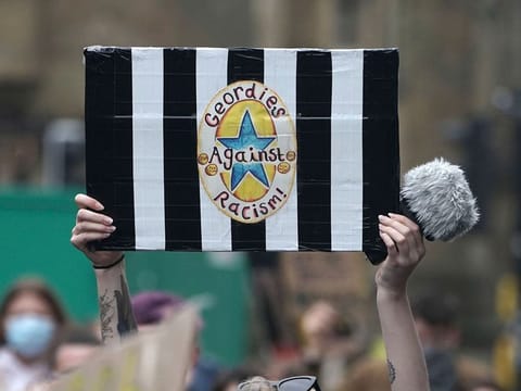 A Newcastle United fan at a Black Lives Matter demonstration.