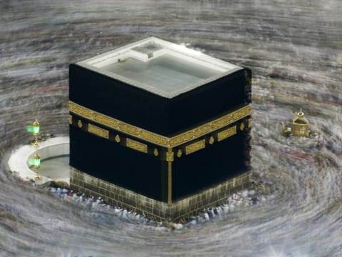 In this August 13, 2019 file photo taken with slow shutter speed, Muslim pilgrims circumambulate the Kaaba at the Grand Mosque, during the Haj in the Muslim holy city of Mecca, Saudi Arabia. 