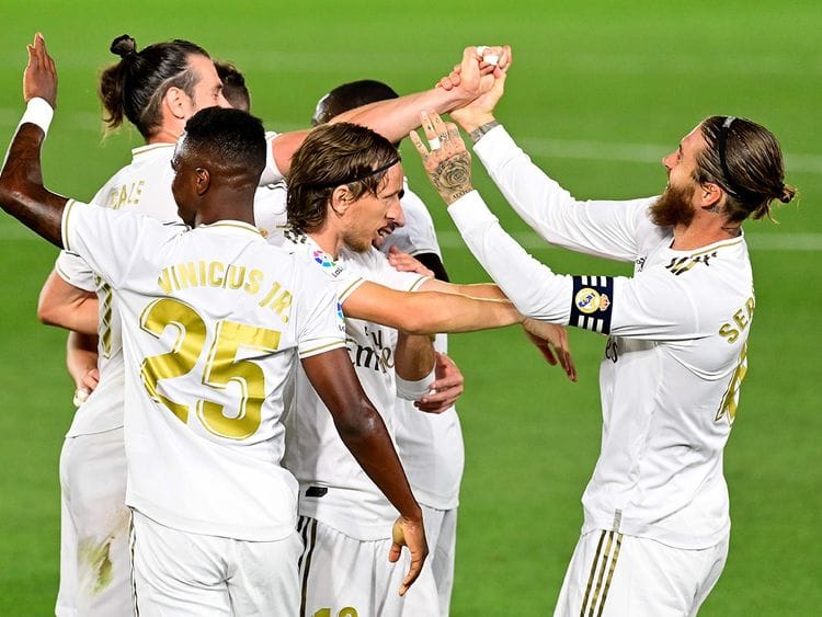 Real Madrid's Sergio Ramos (R) celebrates with teammates after scoring against Mallorca 