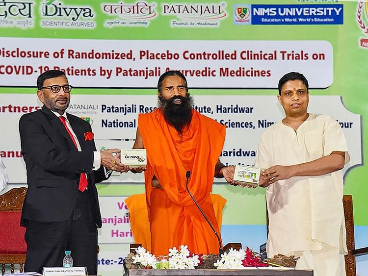 Baba Ramdev (C) along with Acharya Balkrishna